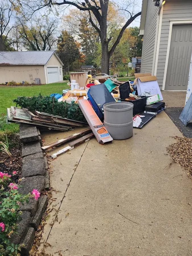Dumpster being loaded with debris for Commercial Dumpster Rental in Buena Vista